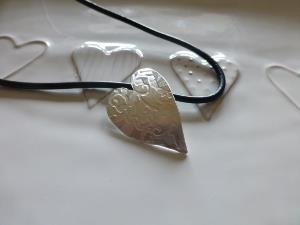 Embossed sideways heart pendant 