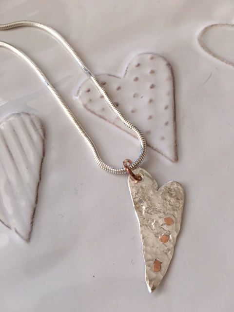 Dainty textured heart with gold rivets
